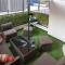 Darkwood Haven - Luxe 2BR Duplex Stay in Oasis, Near Masdar City