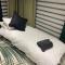 Mini Love Island style guest house includes personal warm 24 hour swimming pool, outdoor bathtub, BBQ and fire pit, all this is secretly located in the busy suburbs of Nottingham