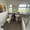 Cosy bungalow with views, walks, garden & parking.