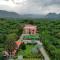 StayVista's Prakriti Farms - Mountain-View Villa with Outdoor Pool, Deck & Lawn featuring a Gazebo - Udaipur