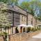 Corn Barn at East Trenean Farm -Luxury Cornish Barn Conversion sleeping 8 with hot tub, private garden, rural views and EV facilities - Looe