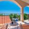 Teuta Apartments - a beach and a sea view