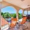 Teuta Apartments - a beach and a sea view