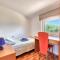 Teuta Apartments - a beach and a sea view