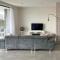 Design Apartment with 60m² terrace - heated inside pool and wellness facilities - very close to the beach