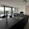 Design Apartment with 60m² terrace - heated inside pool and wellness facilities - very close to the beach