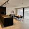 Design Apartment with 60m² terrace - heated inside pool and wellness facilities - very close to the beach