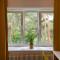 Sunny apartment with lake and forest view