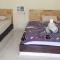 Amed Stop Inn Homestay, Rooftop Restaurant and Bar