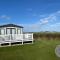 Waterside mini lodge - pet friendly, WiFi, direct beach access & club on site - Meadow Lakes Caravan & Lodge Hire - Ingoldmells