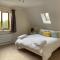 Stylish contemporary seaside holiday home with 5 bedrooms, sea view, parking and EV point