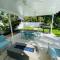 Tropical paradise! Walking distance to the beach!