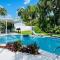 Tropical paradise! Walking distance to the beach!
