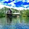 Secluded cabin on the water with jet skis, kayaks, & hot tub! Pet friendly - Satsuma