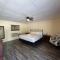 JI5, King Guest Room at the Joplin Inn at entrance to the resort Hotel Room