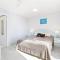 Sandy Straits Poolside Escape with Beach Access