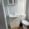 Sweet Cute blue tiny home with Pool and 2 minute drive to the beach