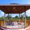 StayVista at Riverfront Cottage with Scenic River view, BBQ, Bonfire, Gazebo, Pet friendly