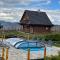 Domki Zagroda Domek z bala z basenem &sauna & jacuzzi & balia