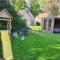 7 person House with garden, firepit, swimming lake, hammock, child friendly, in- and outside playground, slide, and great coffee - Ewijk