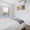GardenView Modern Condo with Parking, Gym, Pool, AC