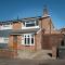 Stunning and modern house with free parking plenty of space and an outdoor garden to enjoy presented by Our Home Short Stays
