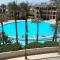 Lovely first floor tow bed rooms overviewing circular pool in Talabay Aqaba