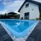 Domek Viking z prywatnym ogrzewanym basenem sauną oraz balią z jacuzzi