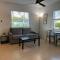 Poolside King Cottage with Kitchen - 10 Minutes to Beach!