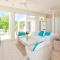 Aqua Del Rose 2 BR Beachfront Cottage - Long Bay Hills