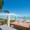 Aqua Del Rose 3 BR Beachfront Cottage