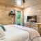 SmokiesBoutiqueCabins would love to host you at Dollys Cute Cabin! 4 Suites with Private Bathrooms - Hot Tub, Fire Pit, Game Room, Resort Pool open Memorial Day through Labor Day!