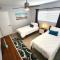 Modern Oasis! Walk to Beach, King Bed, Backyard & Workspace