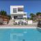 New modern luxury villa near the beach with sea view, pool, sauna , BBQ and playground by WiiBuk