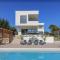 New modern luxury villa near the beach with sea view, pool, sauna , BBQ and playground by WiiBuk