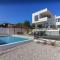 New modern luxury villa near the beach with sea view, pool, sauna , BBQ and playground by WiiBuk
