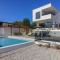 New modern luxury villa near the beach with sea view, pool, sauna , BBQ and playground by WiiBuk