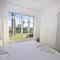 Garden Floor Condo with Promenade Sea View