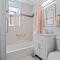 Newly rehabbed Greystone with 2 private apartments, backyard, garage, laundry, close to expressway