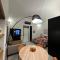 Dislocati BnB - Jacuzzi privata - Cucina - TV60 - Minimal Luxury