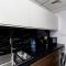 Waves Holiday Homes - Cozy & Fully Furnished Studio in Dubai Sports City