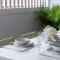 The Elements l Air l 4 Stunning Apartments each with Private Outdoor Dining l Walk to the Beach l Event Friendly l Wifi l Netflix l Outdoor Shower l Communal BBQ Pavilion and Lawn Area l
