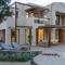 Beachfront Linum Escape Retreat with a Heated Pool - Айос-Ніколаос