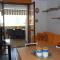 Enjoy the beach breeze in our colorful flat - Bibione