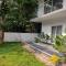 Ultra Modern Glass house with large Swimming pool and garden - Kottayam