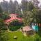 Sea Breeze by StayVista - Beachside bliss with a splash of creativity with Pool, gazebo, lush lawn, and an artistically inspired house