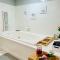 Comfy Lower Lvl Apt with Jetted Tub Near Uptown and UNC