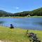 BC Log cabin with private beach river fire pit AC wifi onsite trails ski slope views