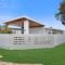 The Elements l Earth l 4 Stunning Apartments each with Private Outdoor Dining l Walk to the Beach l Event Friendlyl Wifi l Netflix l Outdoor Shower l Communal BBQ Pavilion and Lawn Area l