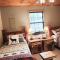 Woods Upon a Time Remodeled Cabin with Fireplace, Pond View & Firepit - Your Getaway Story Awaits!